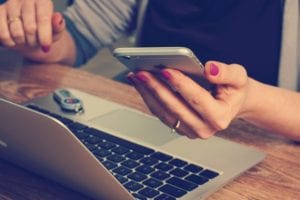 Woman using phone for web search